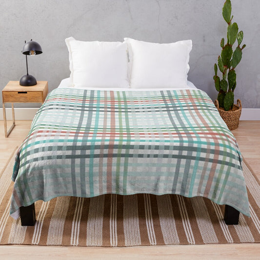 Cozy winter plaid plush blanket in Christmas colors of red, green, and blue