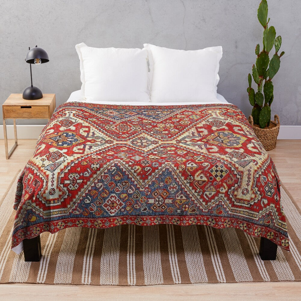 Red and blue plush blanket with Persian-style Qashqai rug design