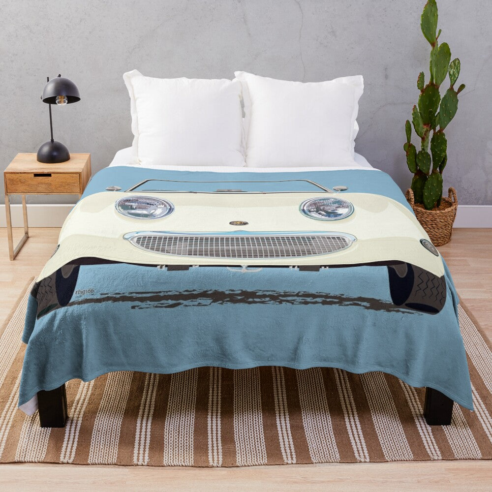 Vintage-inspired Old English White plush blanket featuring a frog/bug eye design inspired by the classic Austin Healey Sprite