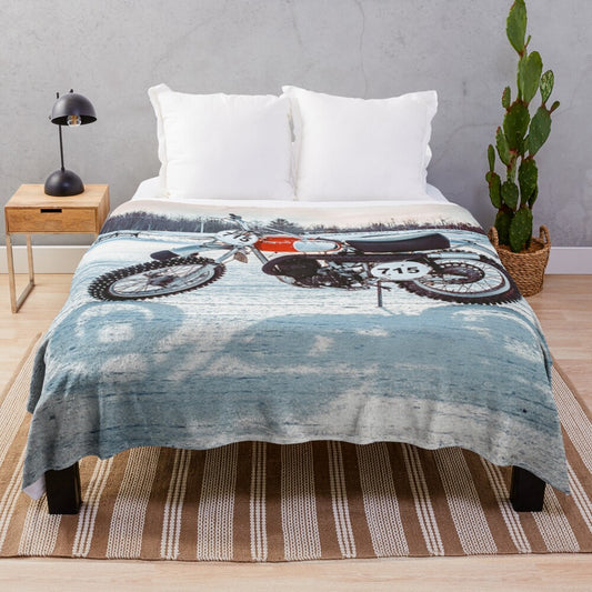 Plush blanket featuring a dirt bike riding on ice or snow