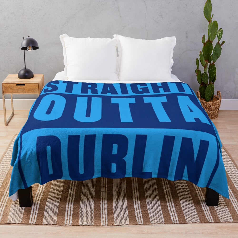 Dublin-inspired plush blanket with music and sports motifs