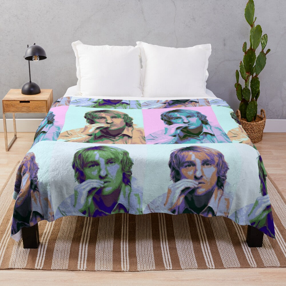 Colorful pop art-style portrait of actor Owen Wilson on a plush blanket