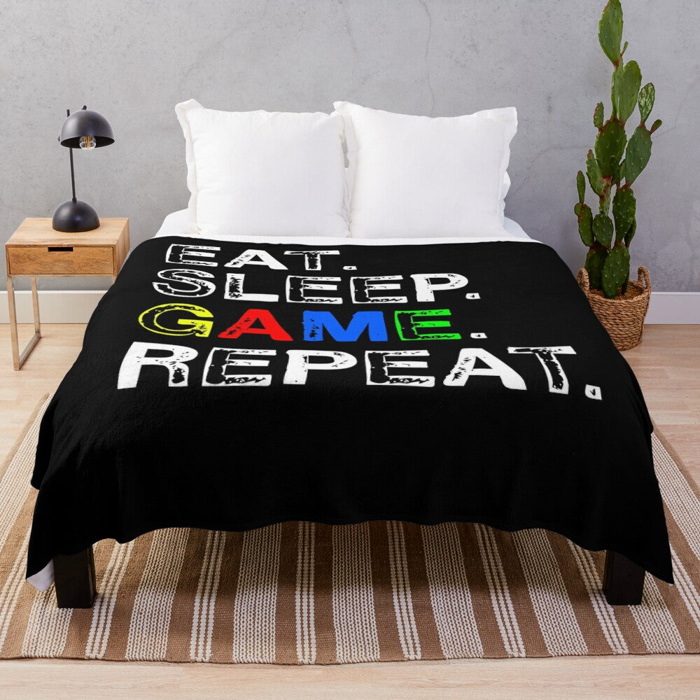 Gaming-themed plush blanket with "Eat, Sleep, Game, Repeat" design