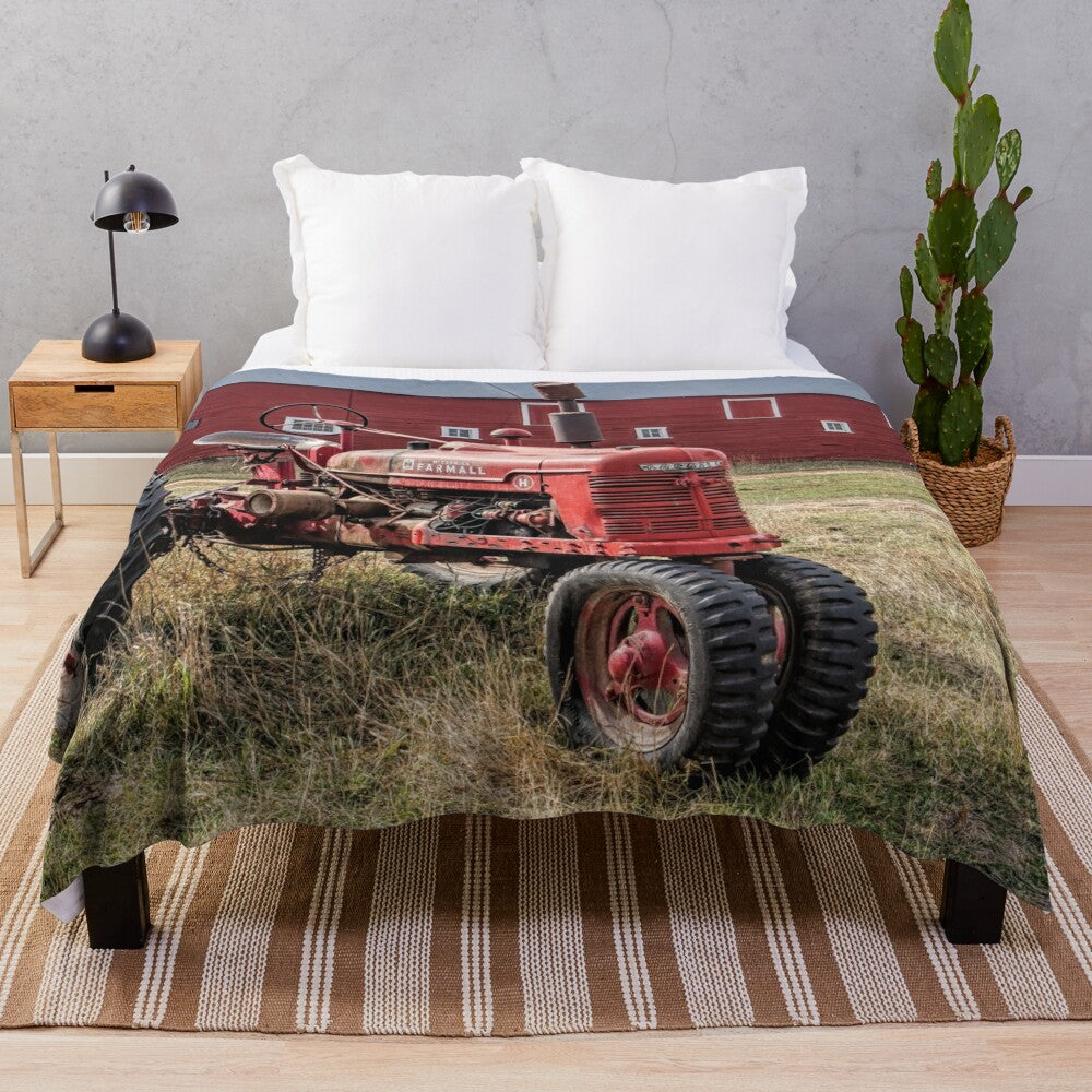 Cozy plush blanket featuring a vintage red Farmall tractor