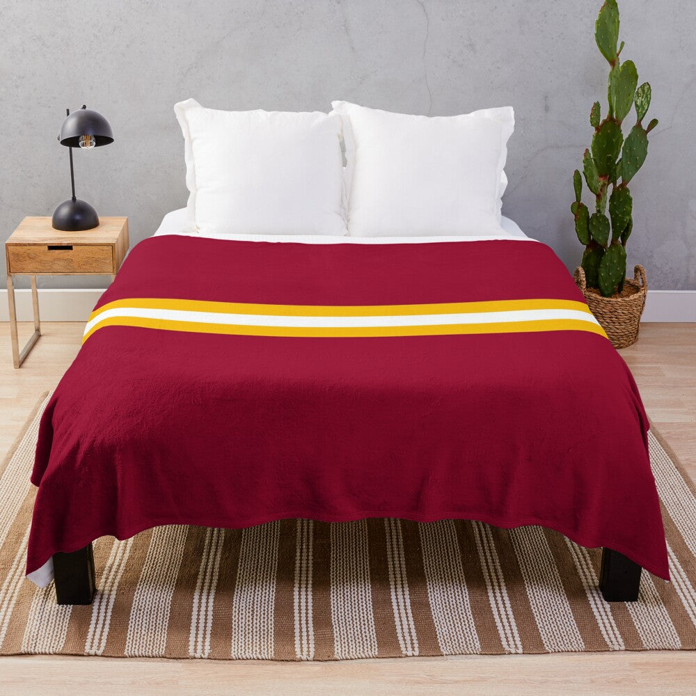 Plush blanket with Roma-inspired striped pattern