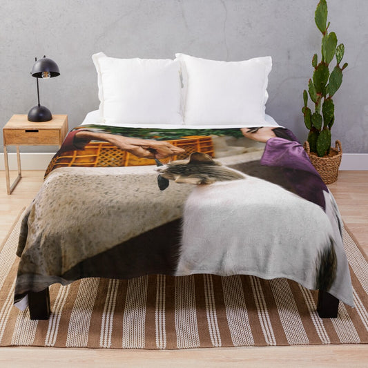 Plush blanket featuring cute cat and fish design