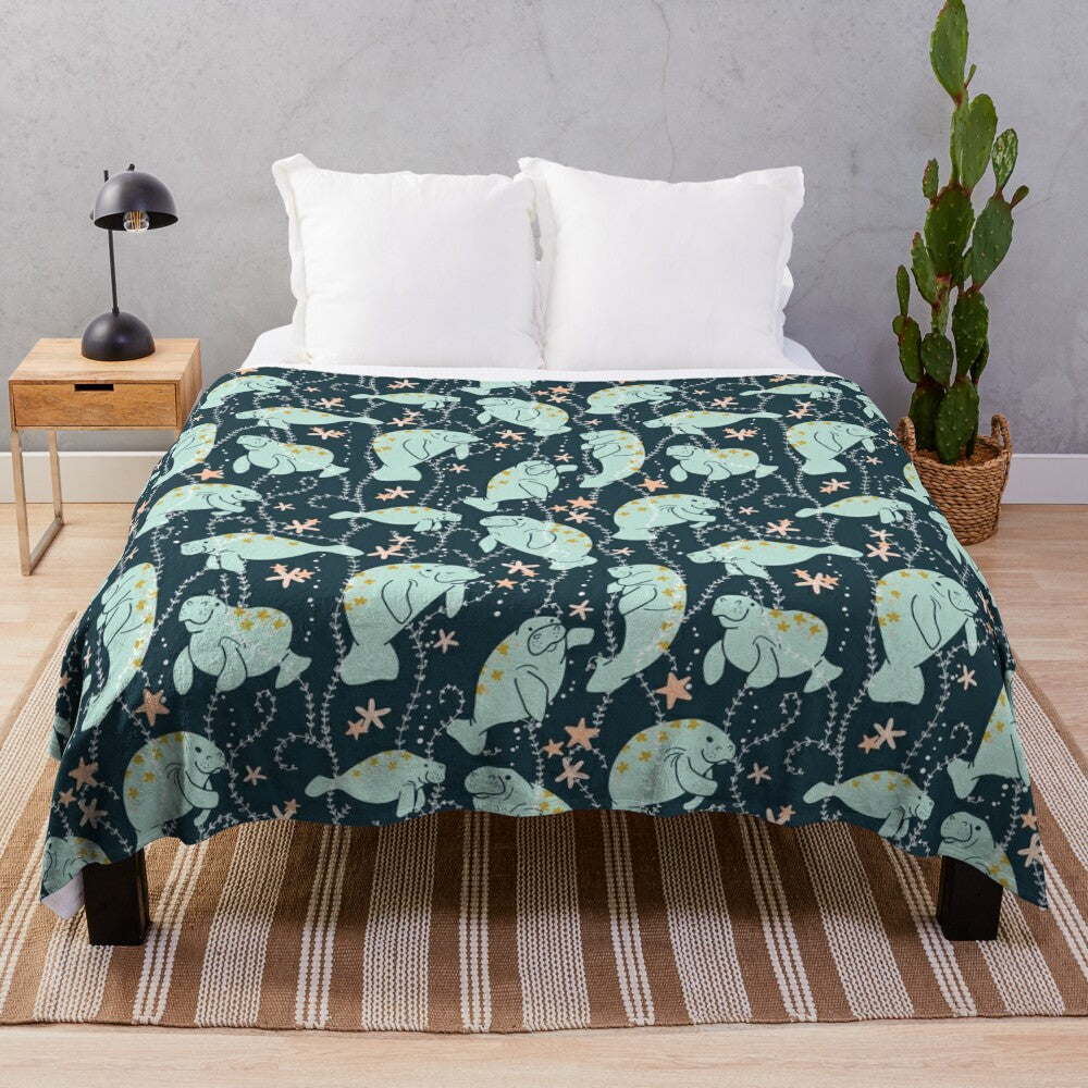 Teal plush blanket featuring a cute manatee illustration