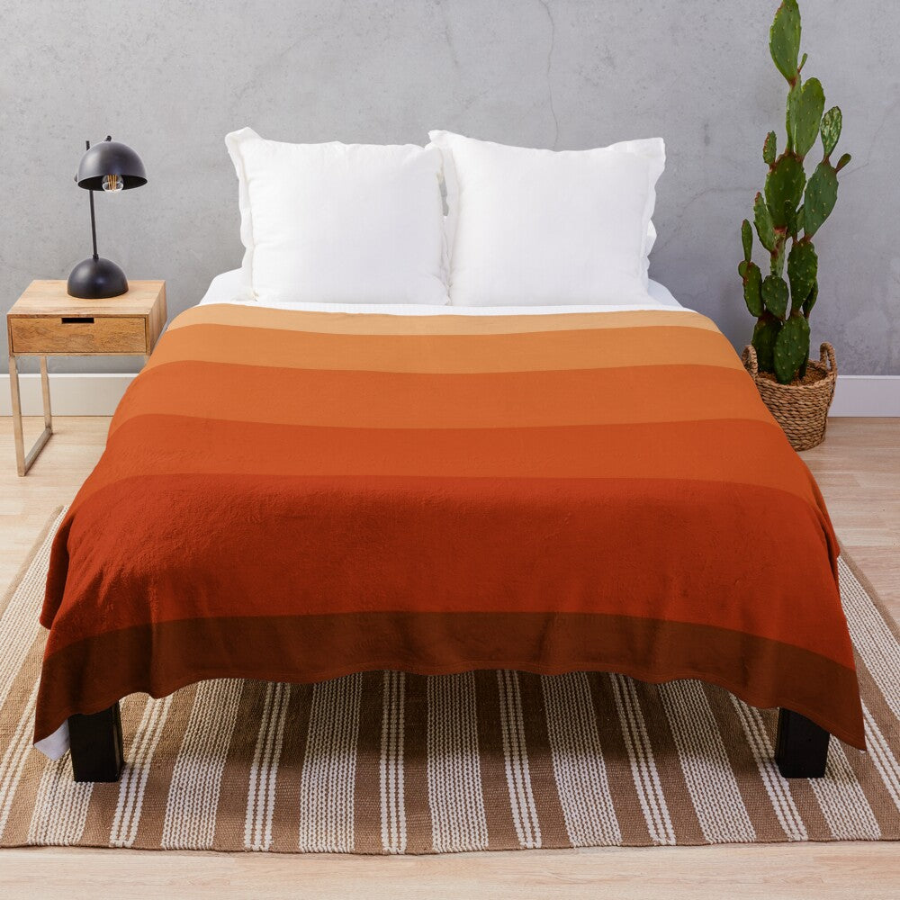 Burnt umber ombre plush blanket with geometric pattern