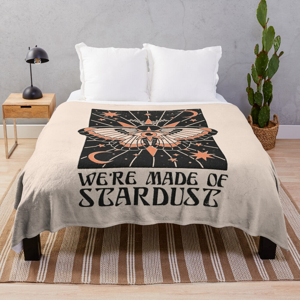 Stardust plush blanket featuring a cosmic, astrological design