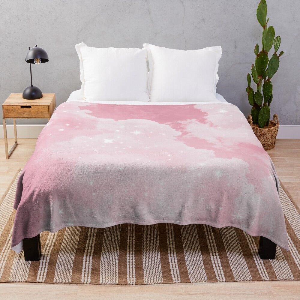 Soft and luxurious plush blanket with a whimsical pink cloud and sparkle design