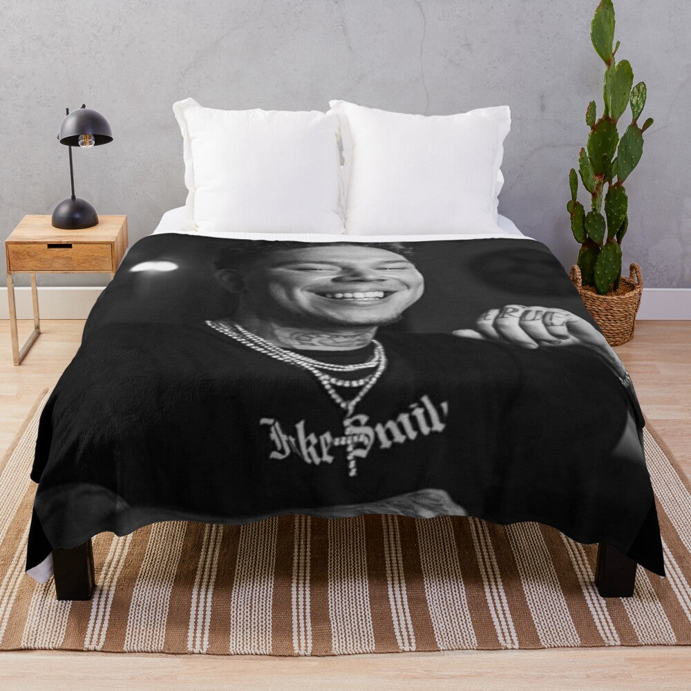 Soft and cozy Phora plush blanket with "Love is Hell" design