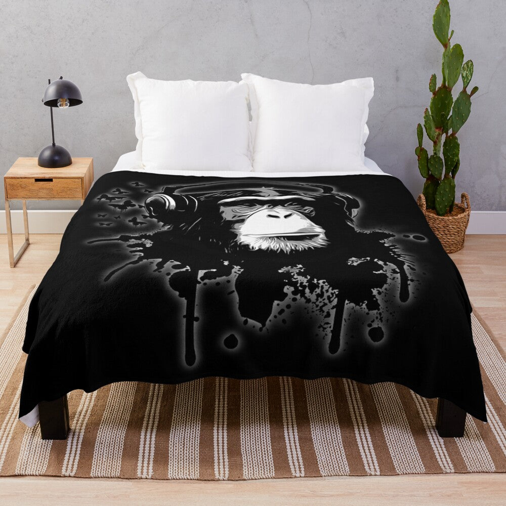 Black plush blanket with abstract monkey graffiti design