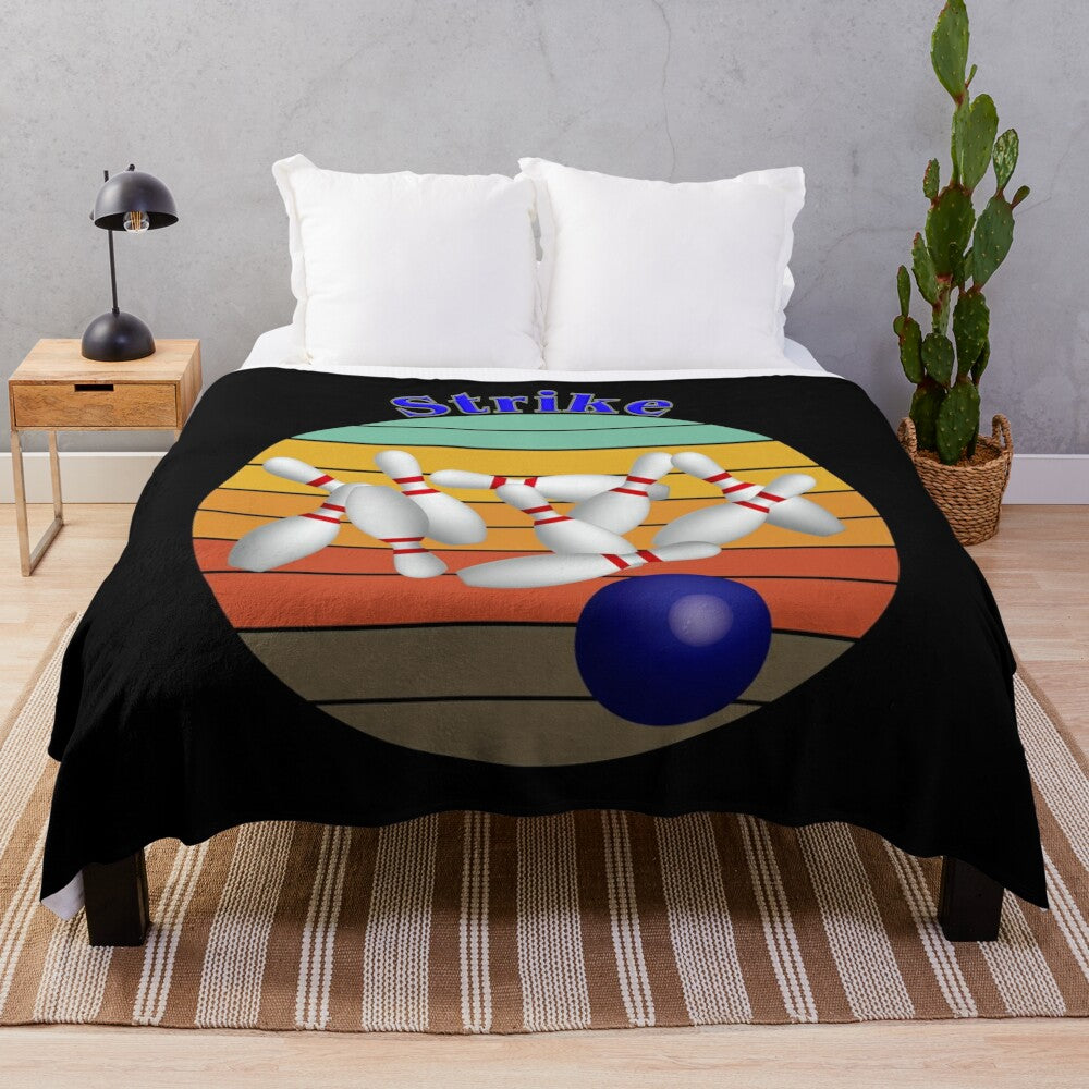 Soft and cozy plush blanket featuring a bowling strike design