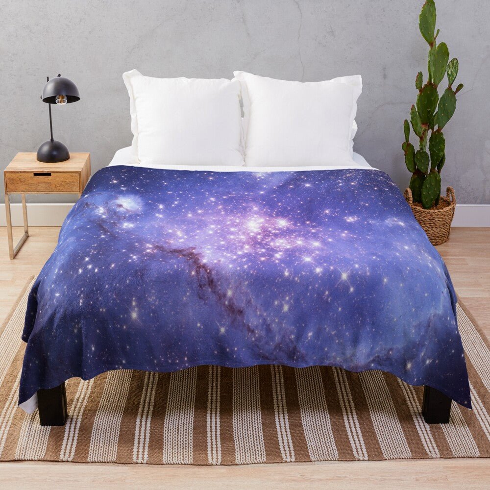 Galaxy plush blanket with stars, planets, and cosmic design