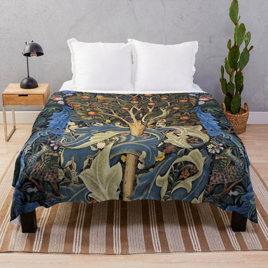 Plush blanket featuring a woodpecker in a fruit tree surrounded by birds, peacocks, and a floral pattern of blue-green leaves