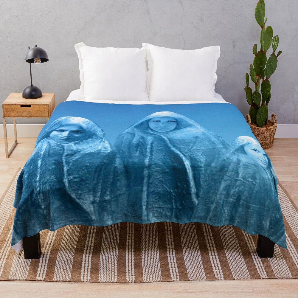 Plush blanket with an ice blue sky and abstract nature-inspired design