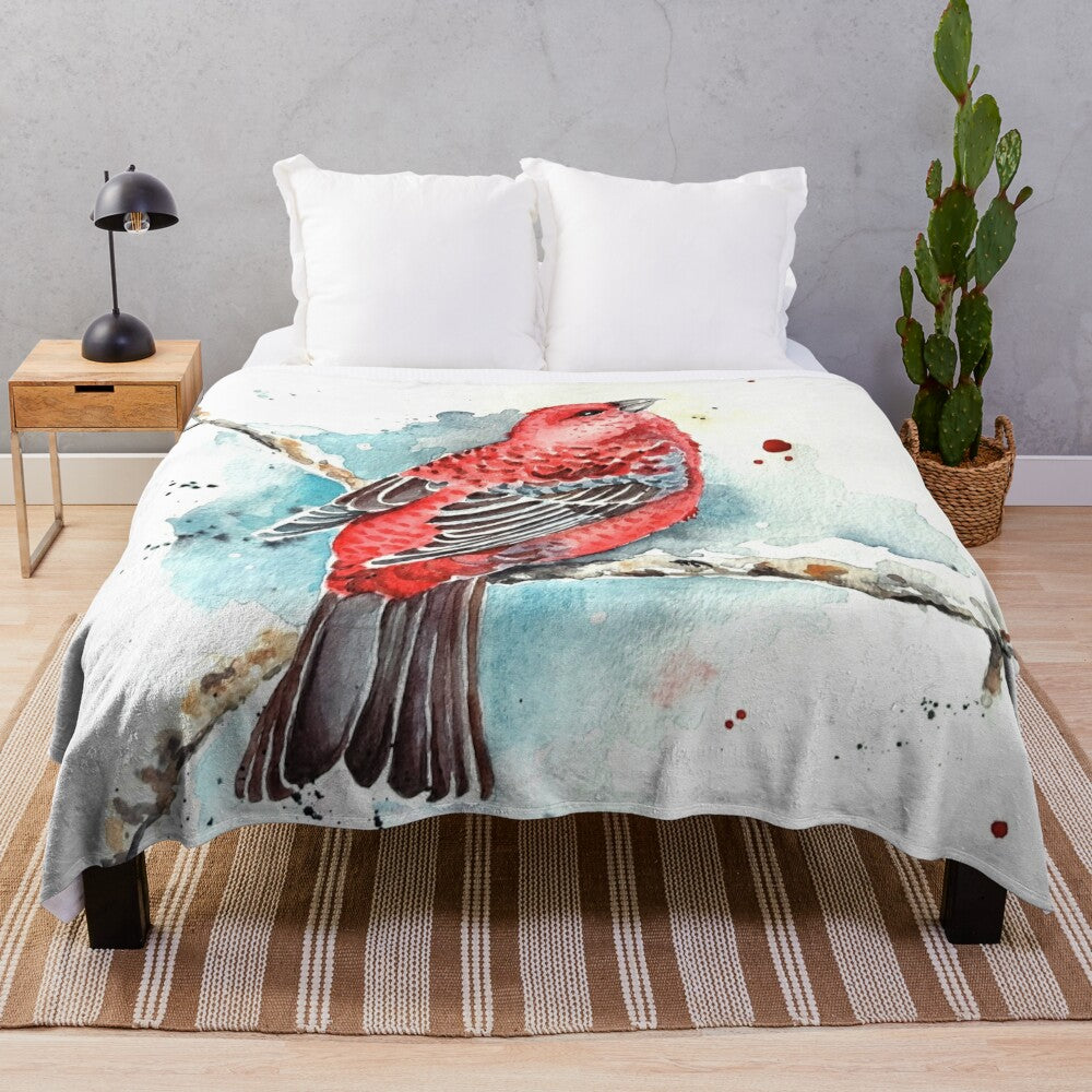 Watercolor painting of a red bird on a plush blanket