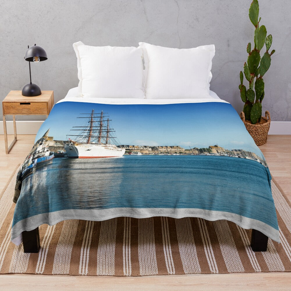 Plush blanket depicting the historic port town of Saint Malo, Brittany, France and the luxury cruise ship Sea Cloud II