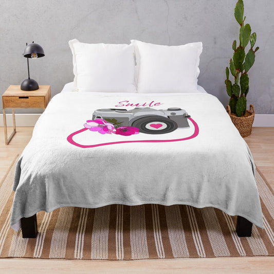 Vintage-inspired camera plush blanket with floral and heart designs