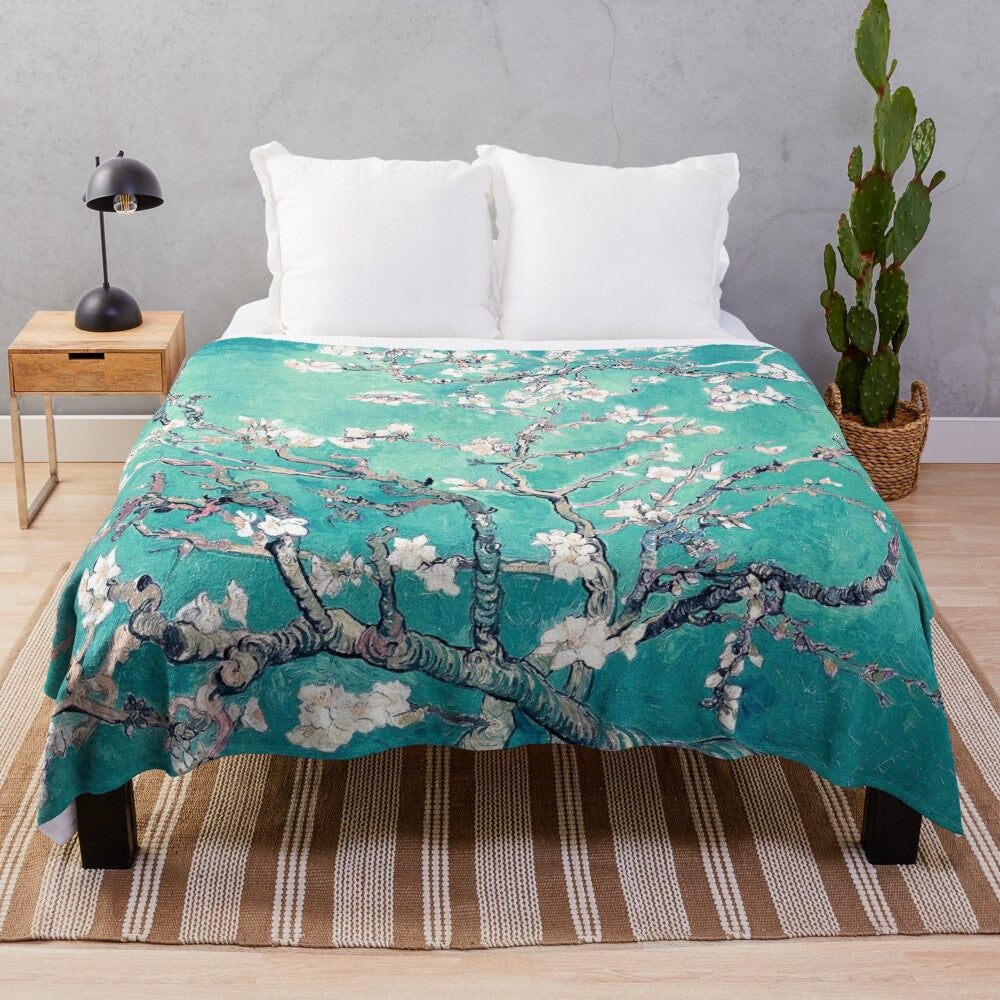 Turquoise plush blanket with Vincent Van Gogh's Almond Blossoms design