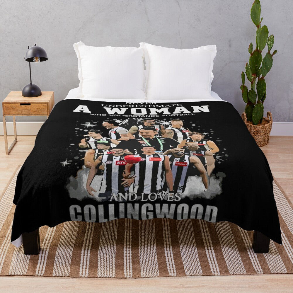 Collingwood plush blanket featuring the team's colors and logo