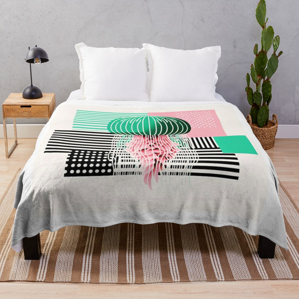 Plush pink blanket with vibrant jellyfish and medusa design in a bauhaus style