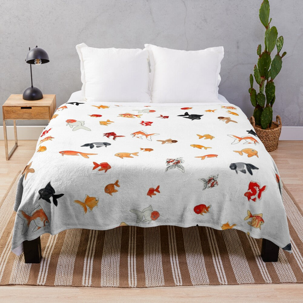 Plush goldfish themed blanket with a collage of different fancy goldfish breeds