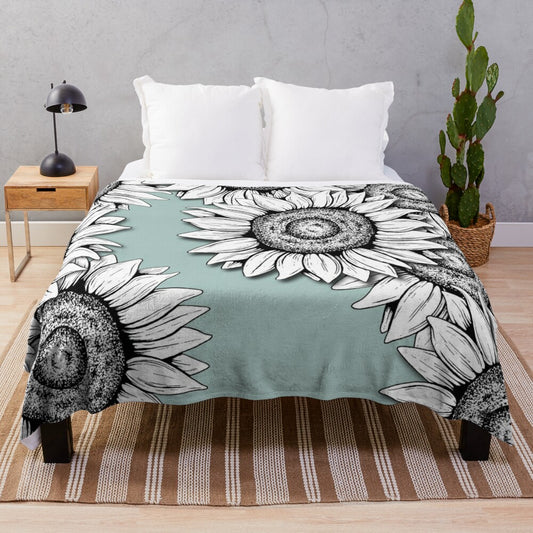 Plush blanket featuring a graphic design of wild flowers in black and white