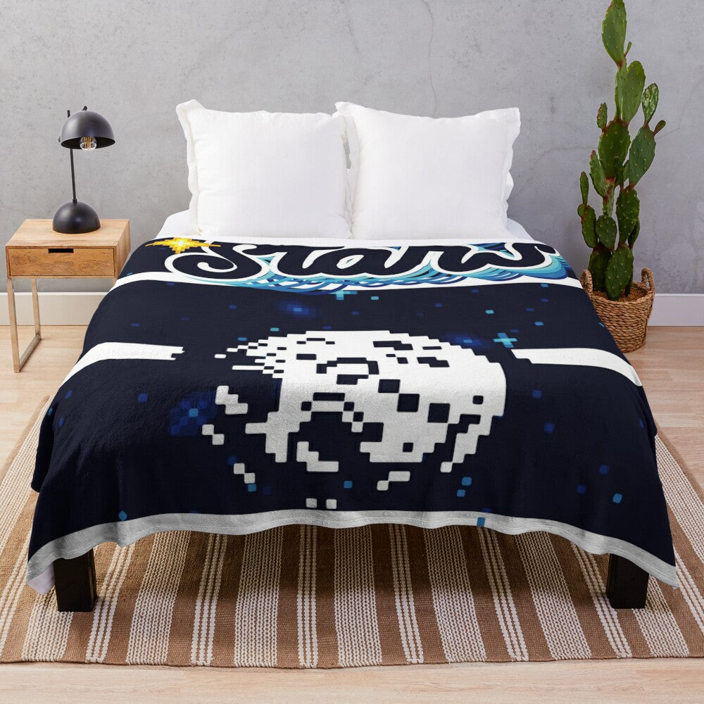 Plush blanket with a galaxy and stars design