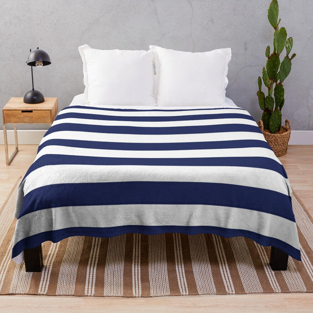 Navy blue and white striped plush blanket