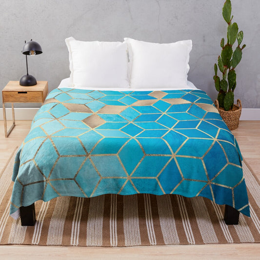 Plush blue and gold geometric cube pattern blanket