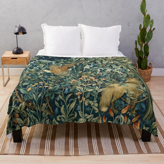 Plush blanket featuring a blue green floral tapestry design with forest animals like pheasant and fox