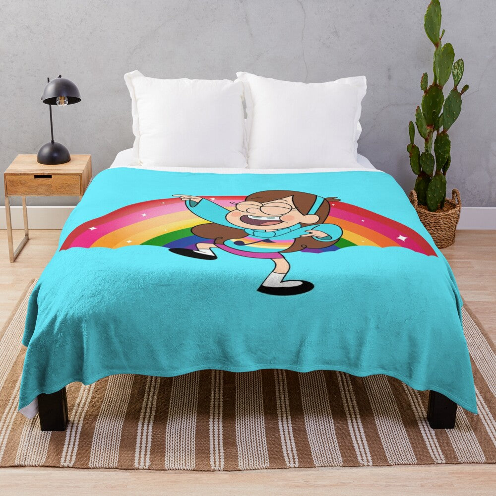 Mabel Pines, the energetic teenager from Gravity Falls, dancing on a rainbow background on a plush blanket.