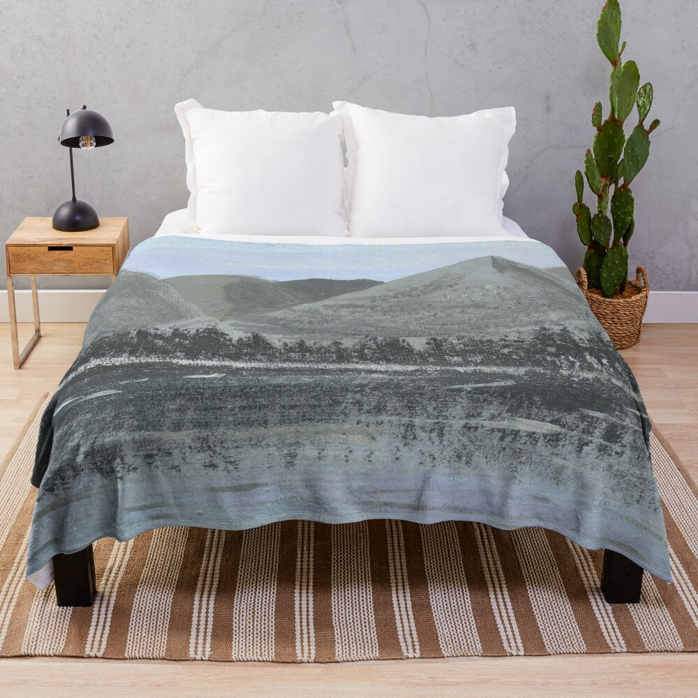 Cozy plush blanket featuring a serene winter landscape