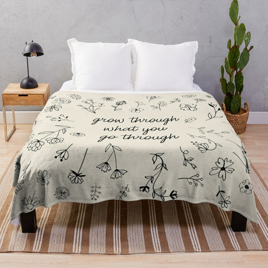 Floral plush blanket with inspirational "Go Through What You Grow Through" quote