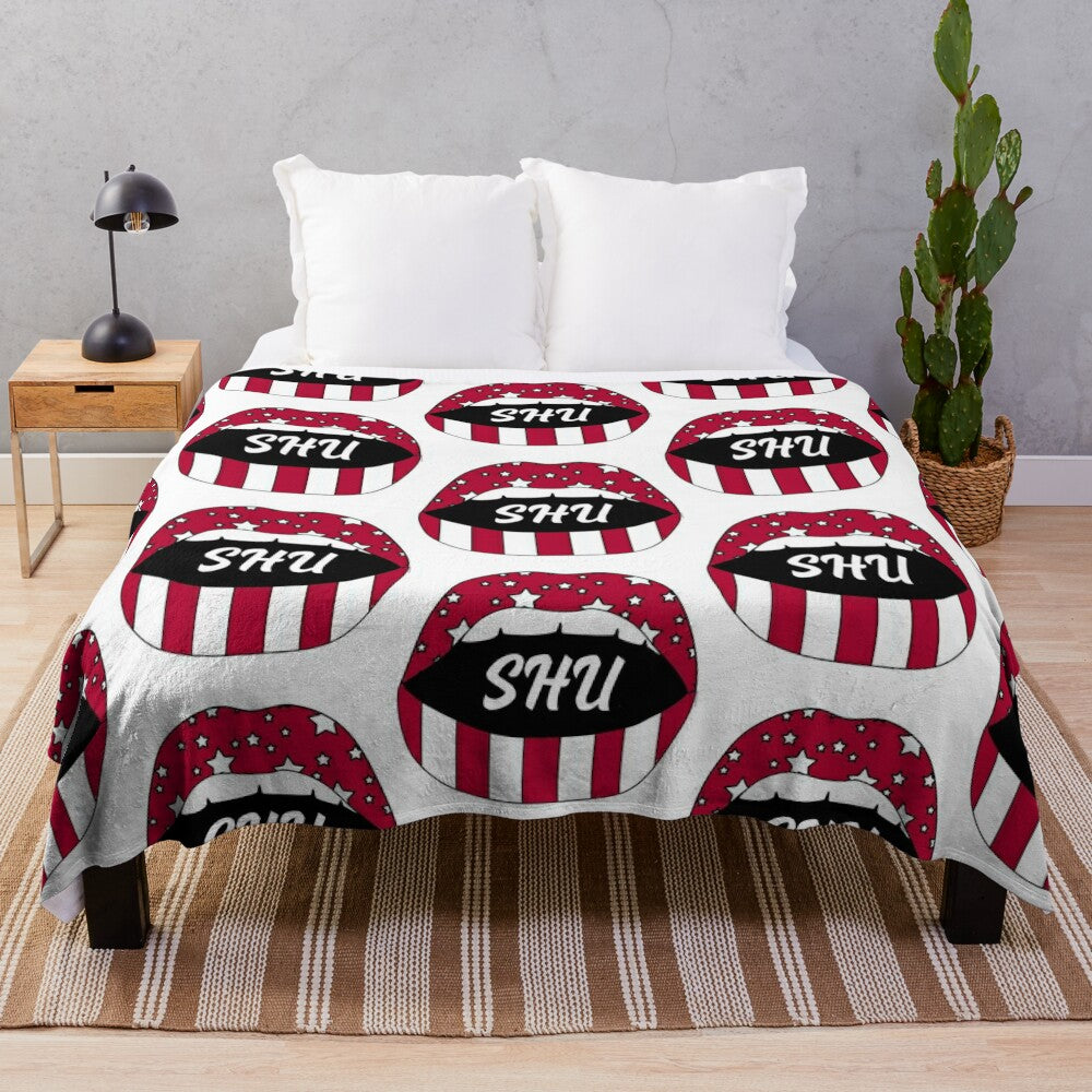 SHU Lips! Plush Blanket featuring the Sacred Heart University Pioneers logo