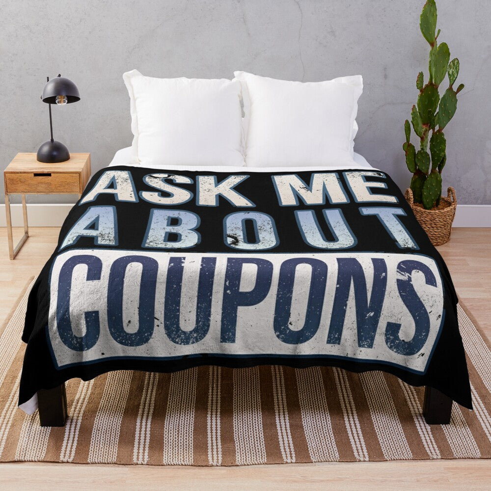 Plush blanket with "Ask Me About Coupons" design