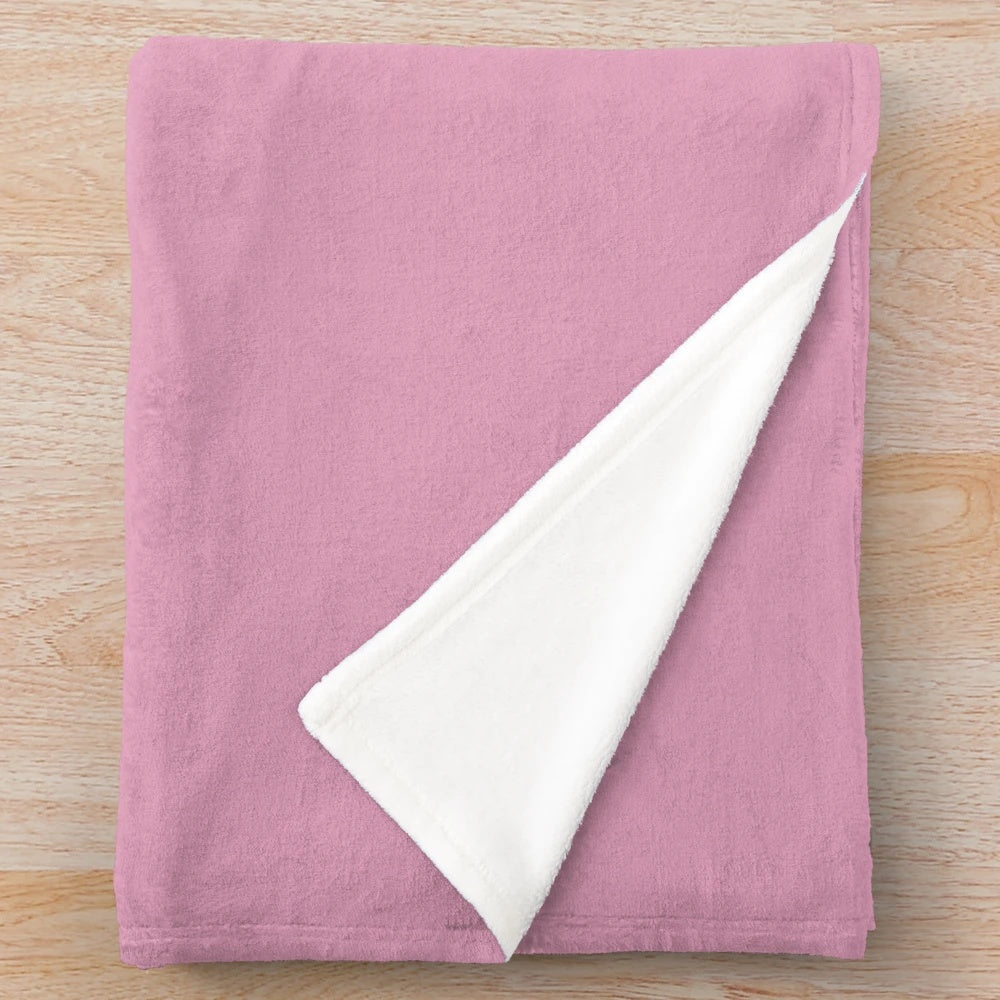 Soft and cozy plush blanket with uterus and flower design, perfect for feminist home decor