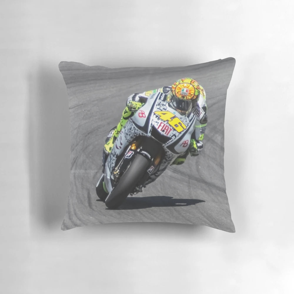 Valentino Rossi riding his Yamaha motorcycle at Laguna Seca racetrack in 2010