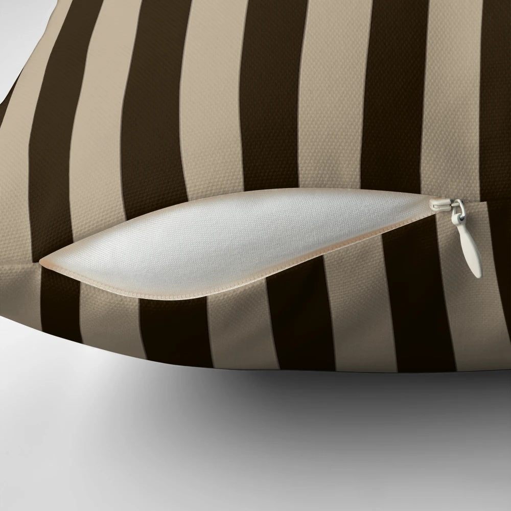 Vertical brown and beige striped decorative pillow with a modern, textured design.