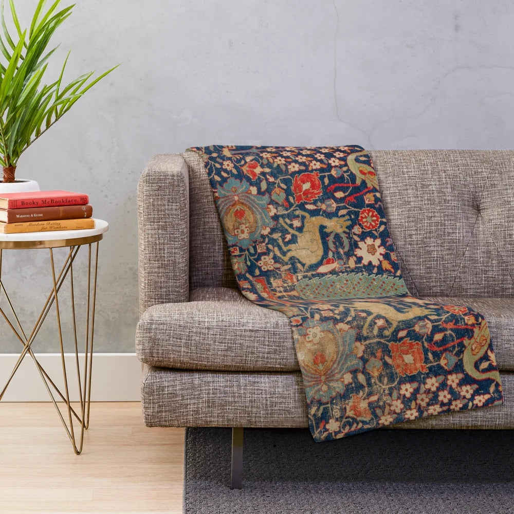 Plush blanket with a vibrant 17th century Persian-style rug pattern featuring animals and floral designs