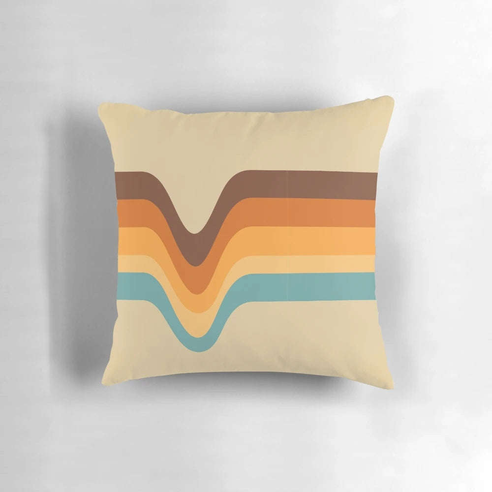 A vintage-inspired striped pillow in shades of orange, yellow, brown, beige, tan, and blue.