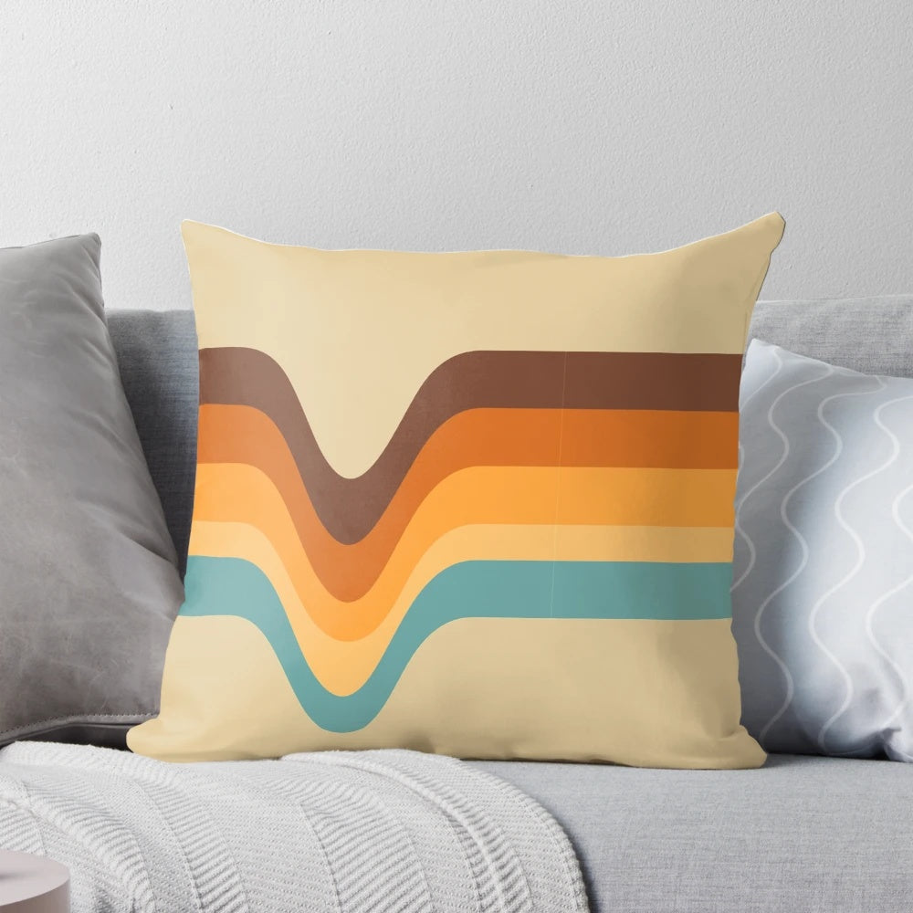 A vintage-inspired striped pillow in shades of orange, yellow, brown, beige, tan, and blue.