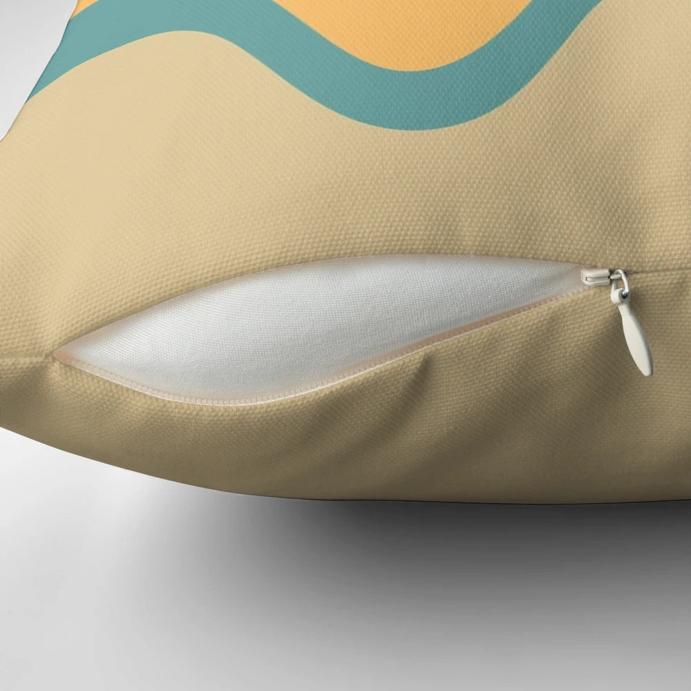 A vintage-inspired striped pillow in shades of orange, yellow, brown, beige, tan, and blue.