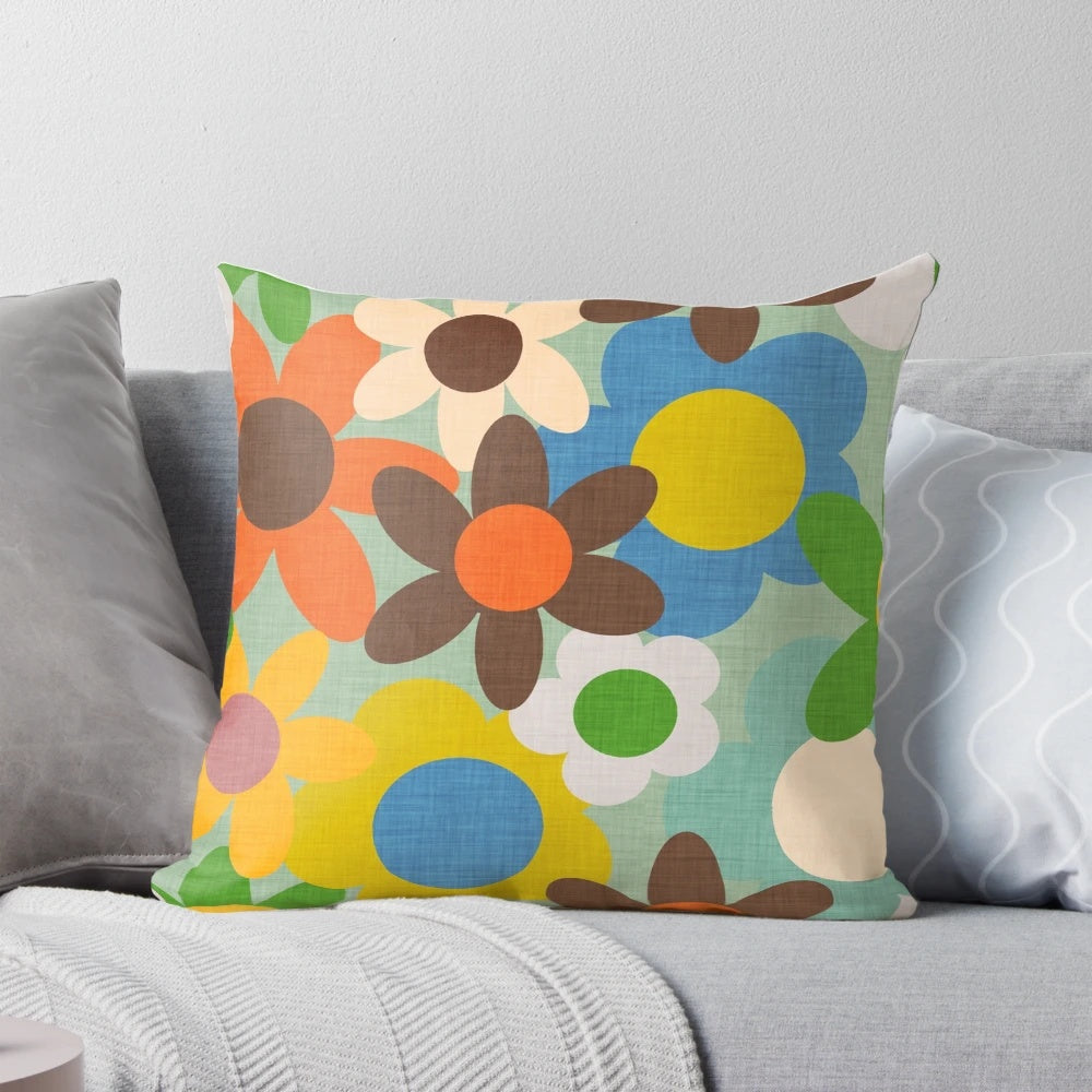 Colorful 70s floral blue pillow featuring a vintage-inspired flower design
