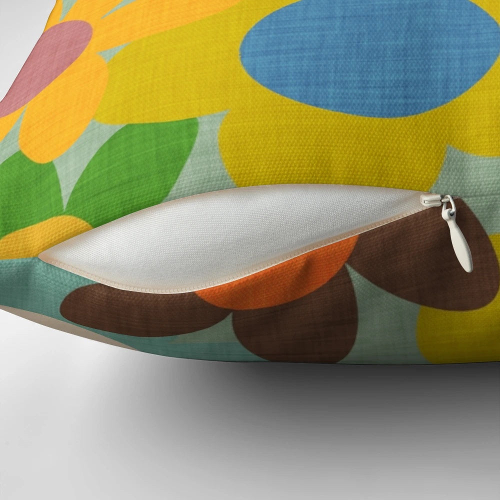 Colorful 70s floral blue pillow featuring a vintage-inspired flower design