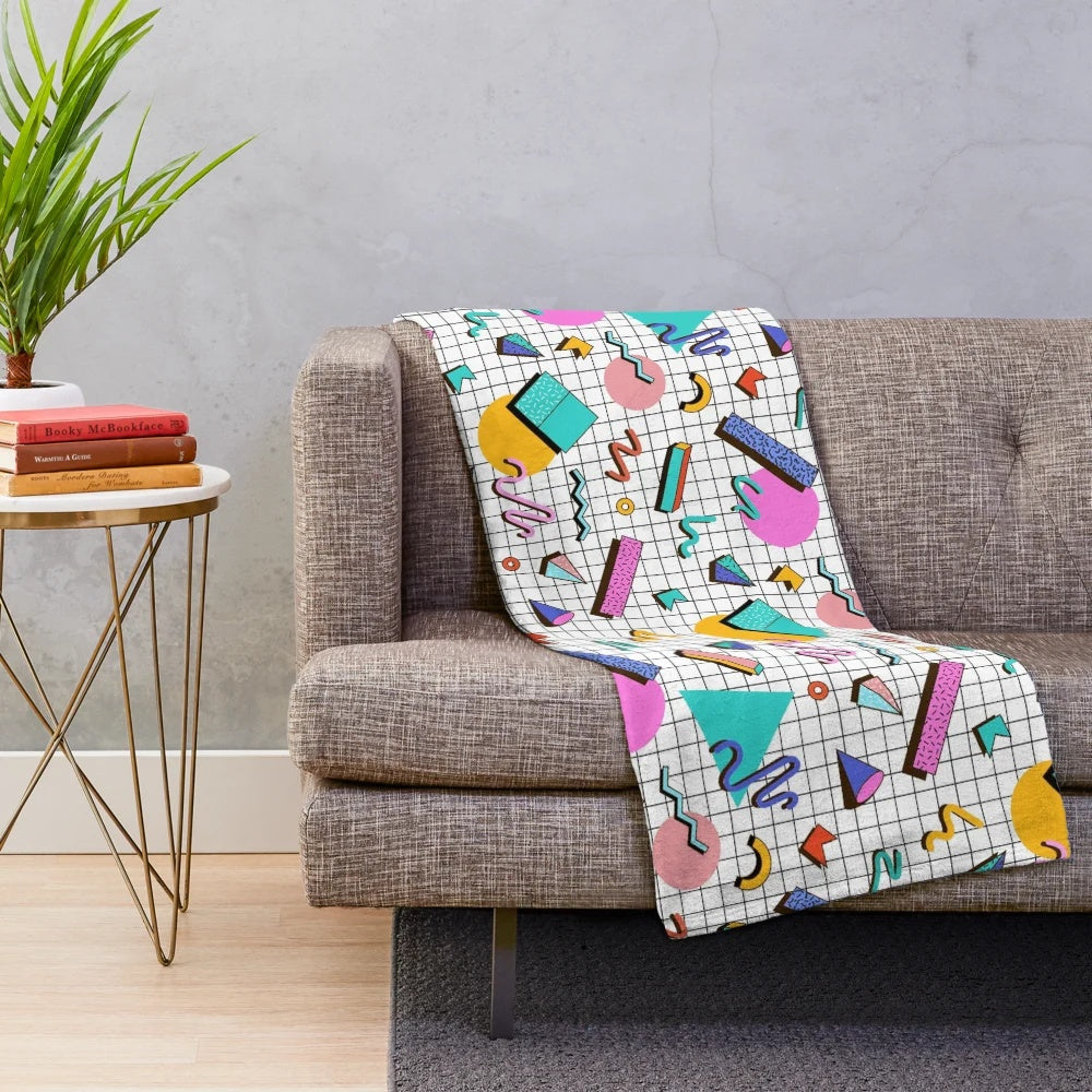 Colorful 80s retro style plush blanket with funky Memphis pattern design