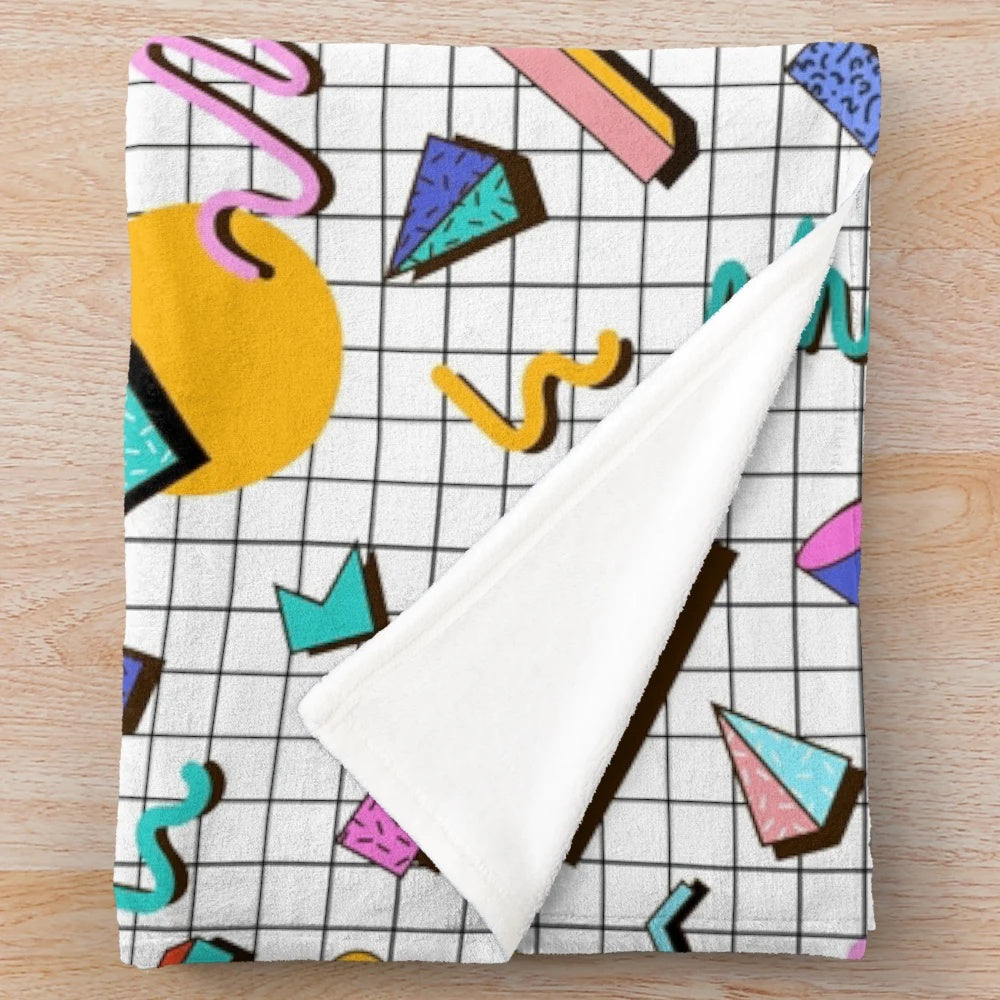 Colorful 80s retro style plush blanket with funky Memphis pattern design