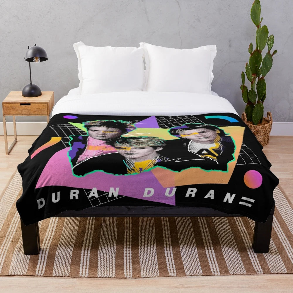 Colorful 80s style plush blanket with vibrant retro colors and abstract pop art graphic design