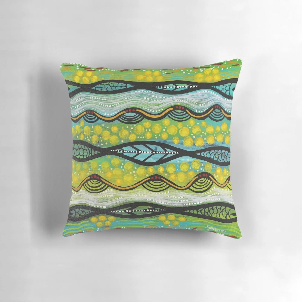 Colorful pillow featuring a Yoongali-designed aboriginal art print of a wattle flower, an iconic Australian native plant.